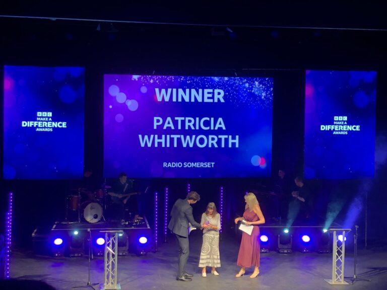 Pat receiving award